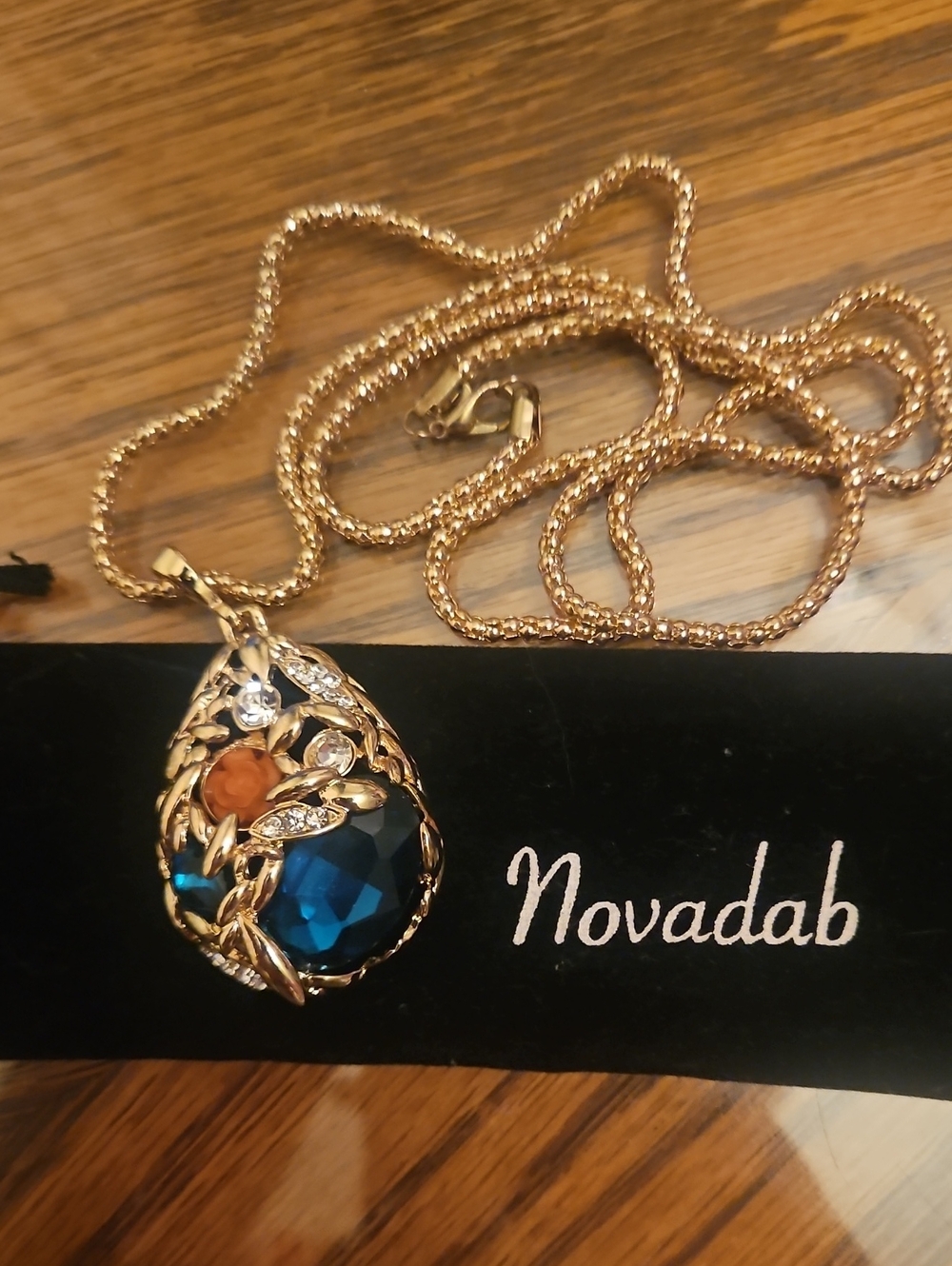 Gold-Tone Teardrop Necklace with Deep Blue and Orange Accents